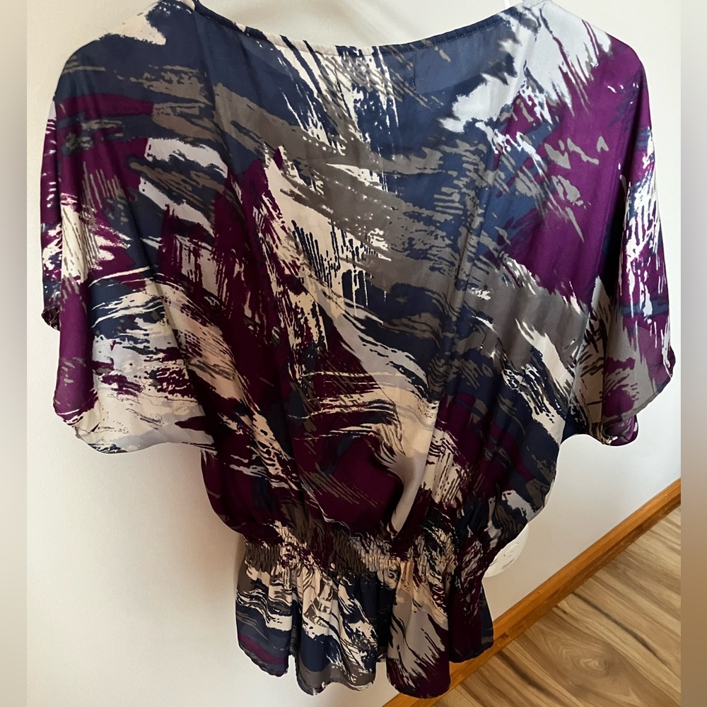 Women’s multicolored Calvin Klein blouse.  Gathers at the waist, good condition
